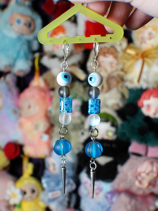 beaming blue eye earrings